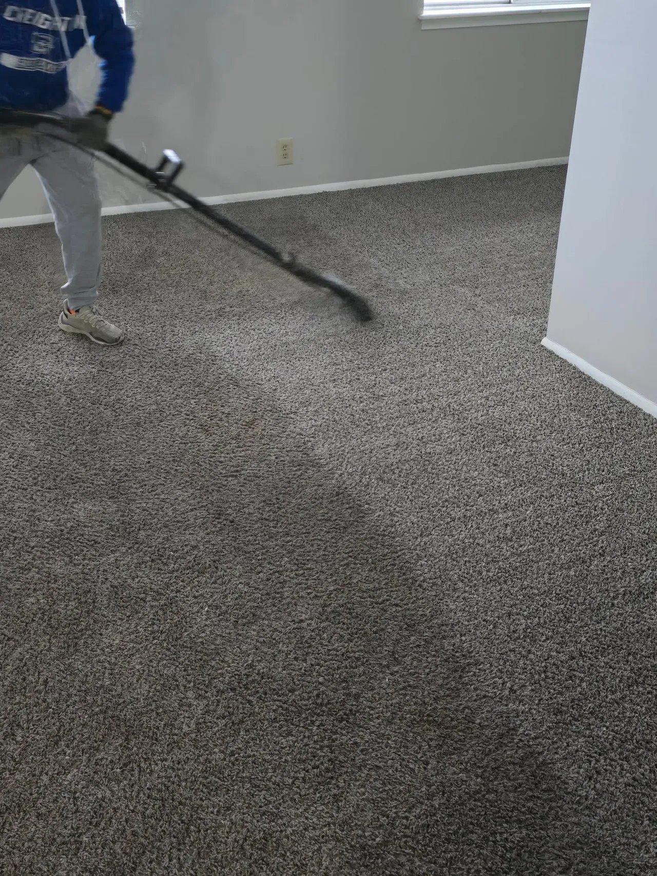 Deep carpet cleaning Omaha NE technician using hot water extraction in a home