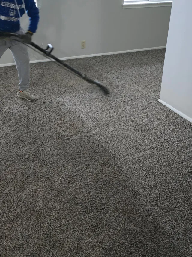 Deep carpet cleaning Omaha NE technician using hot water extraction in a home