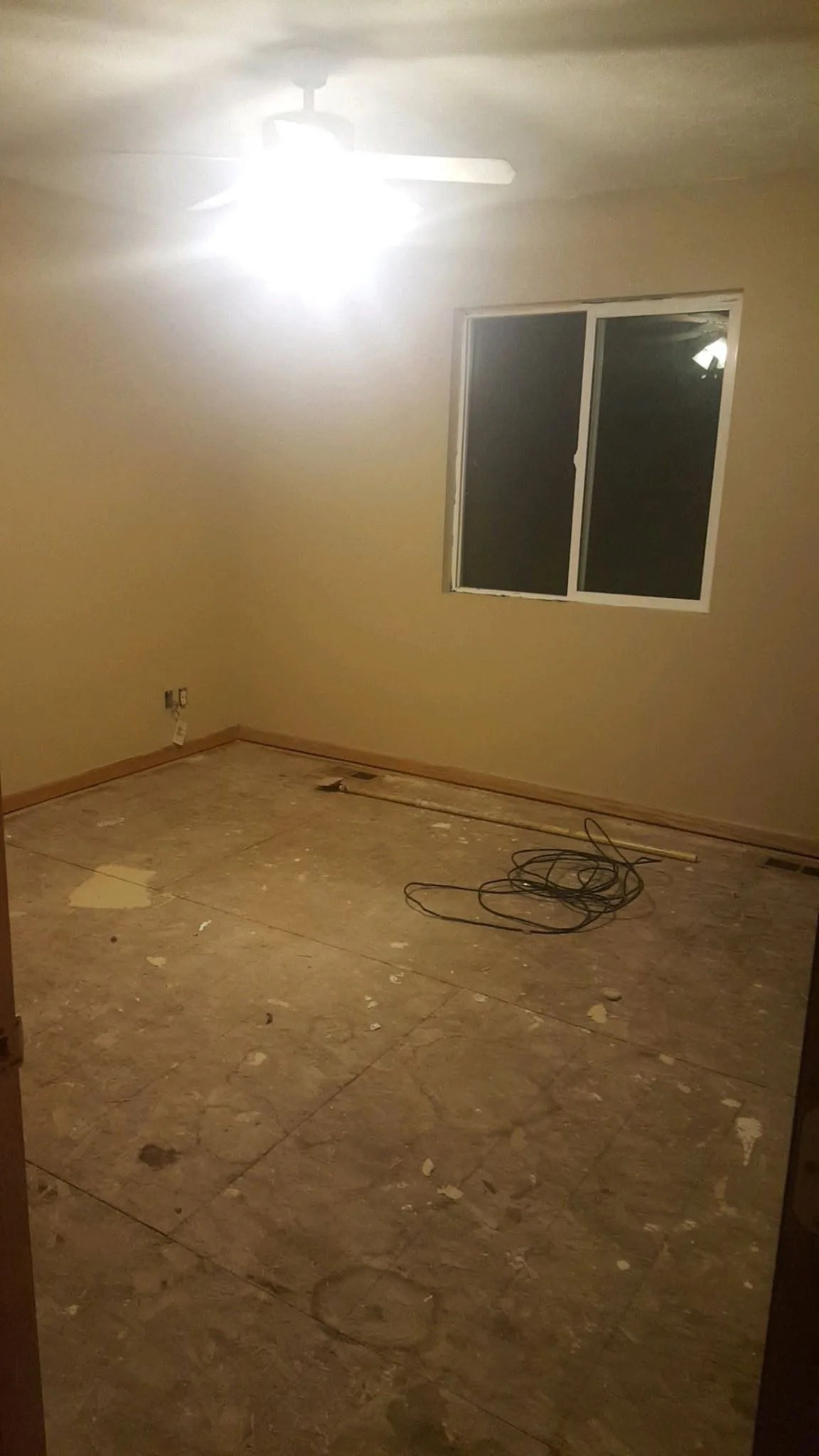 Bare subfloor exposed after old flooring removal during a flooring project in Omaha, NE